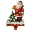 Christmas Central 6.5" Santa Holding Gift Box Christmas Stocking Holder 1 Christmas Central 6.5" Santa Holding Gift Box Christmas Stocking Holder -Christmas Central dnat rac bl80952 1 57947.1587645155